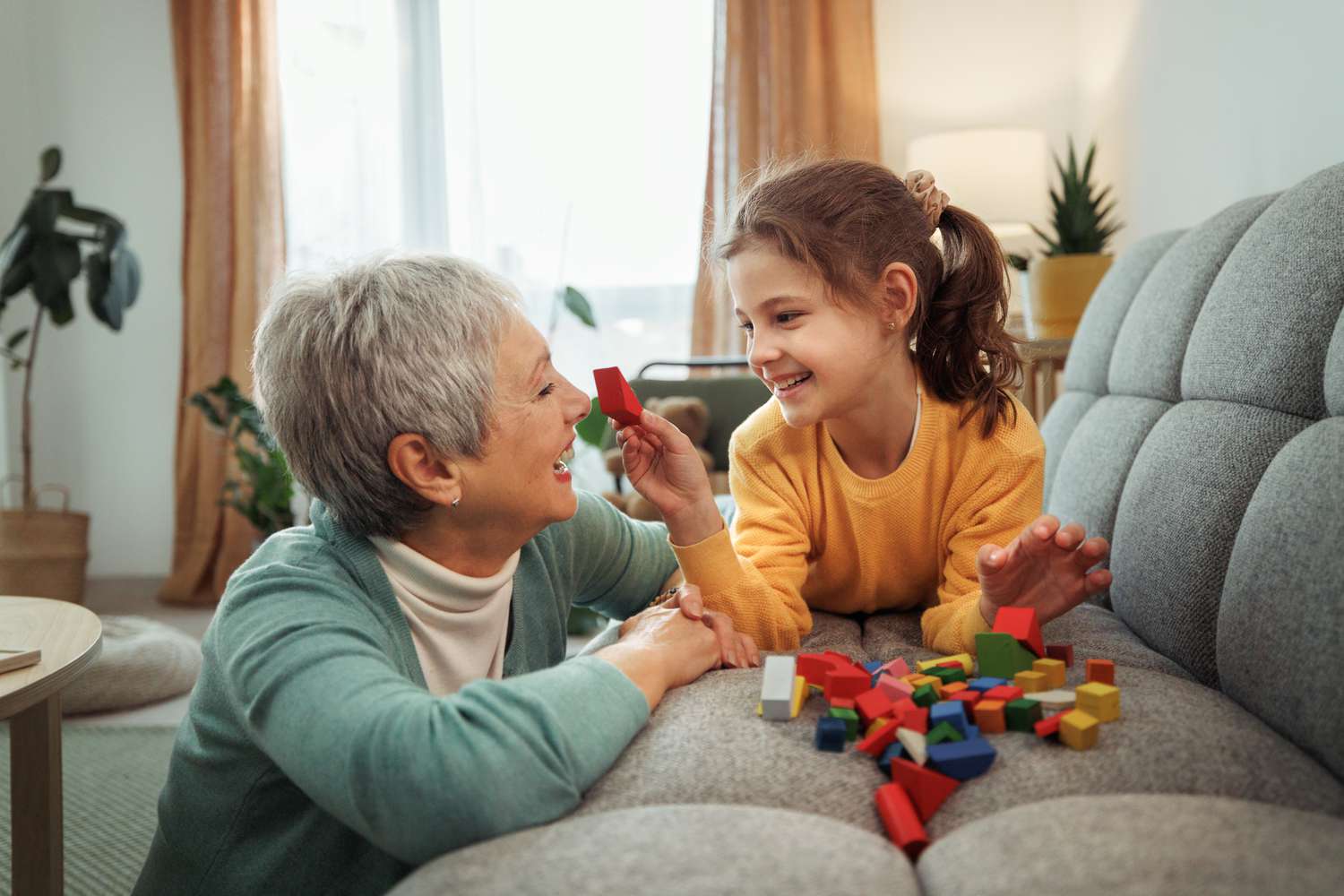 Grandmother and granddaughter playing