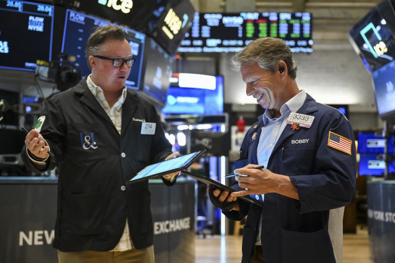 Two traders working on the floor of the New York Stock Exchange. 