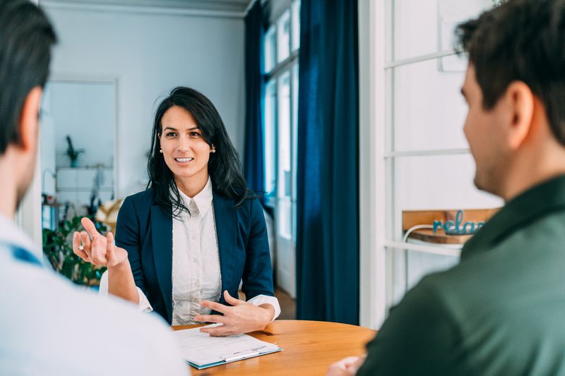 Lender discussing a whole loan with two borrowers