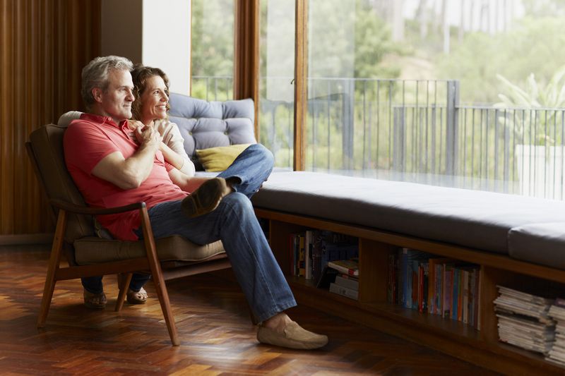 A couple sitting at home