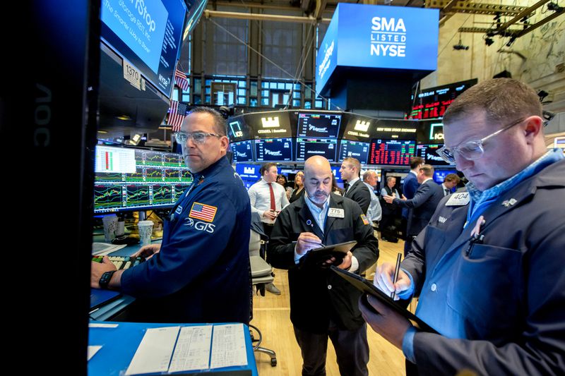 Traders work on the floor of the New York Stock Exchange