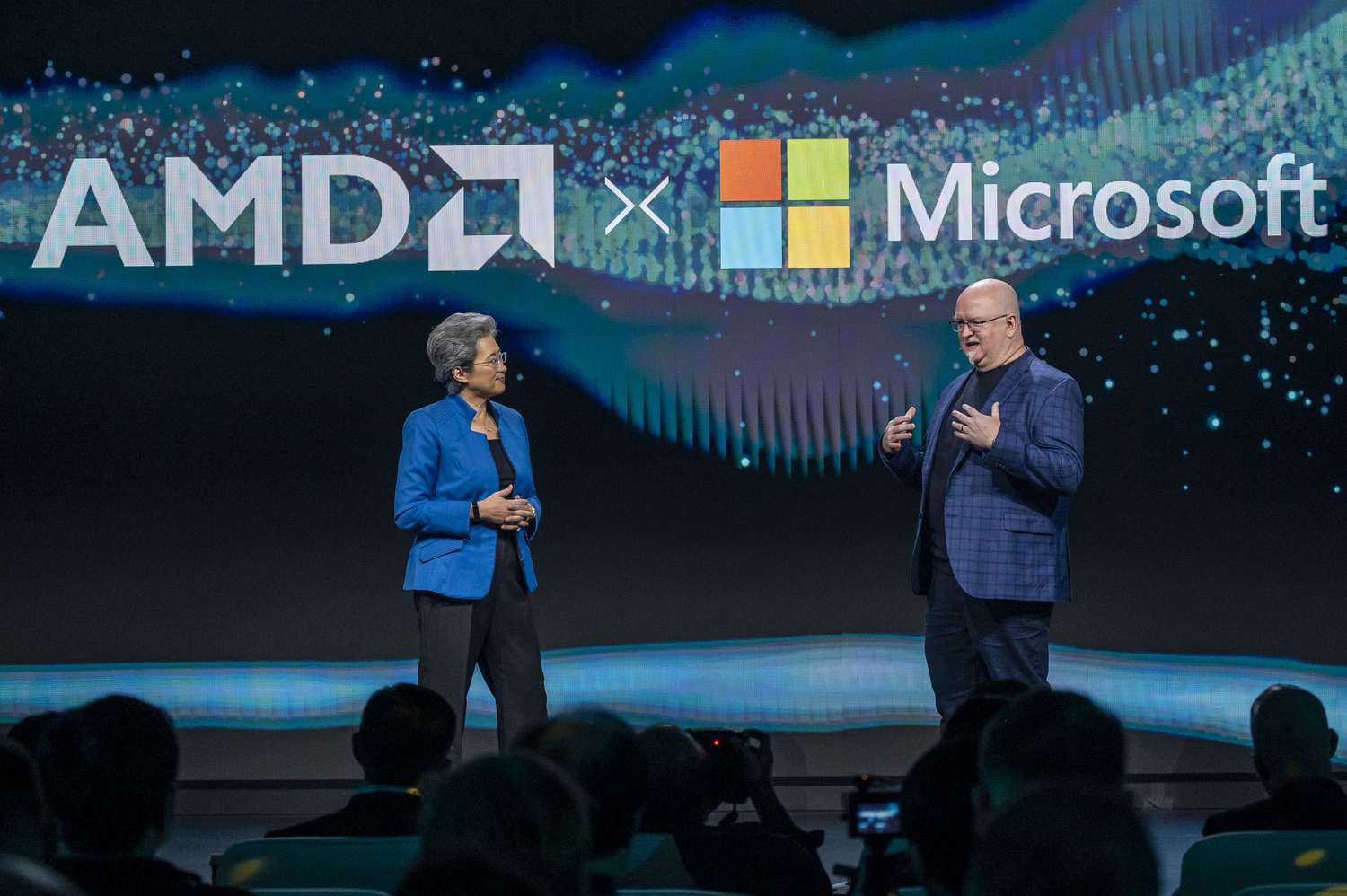 AMD CEO Lisa Su and Microsoft chief technology officer Kevin Scott at an event.
