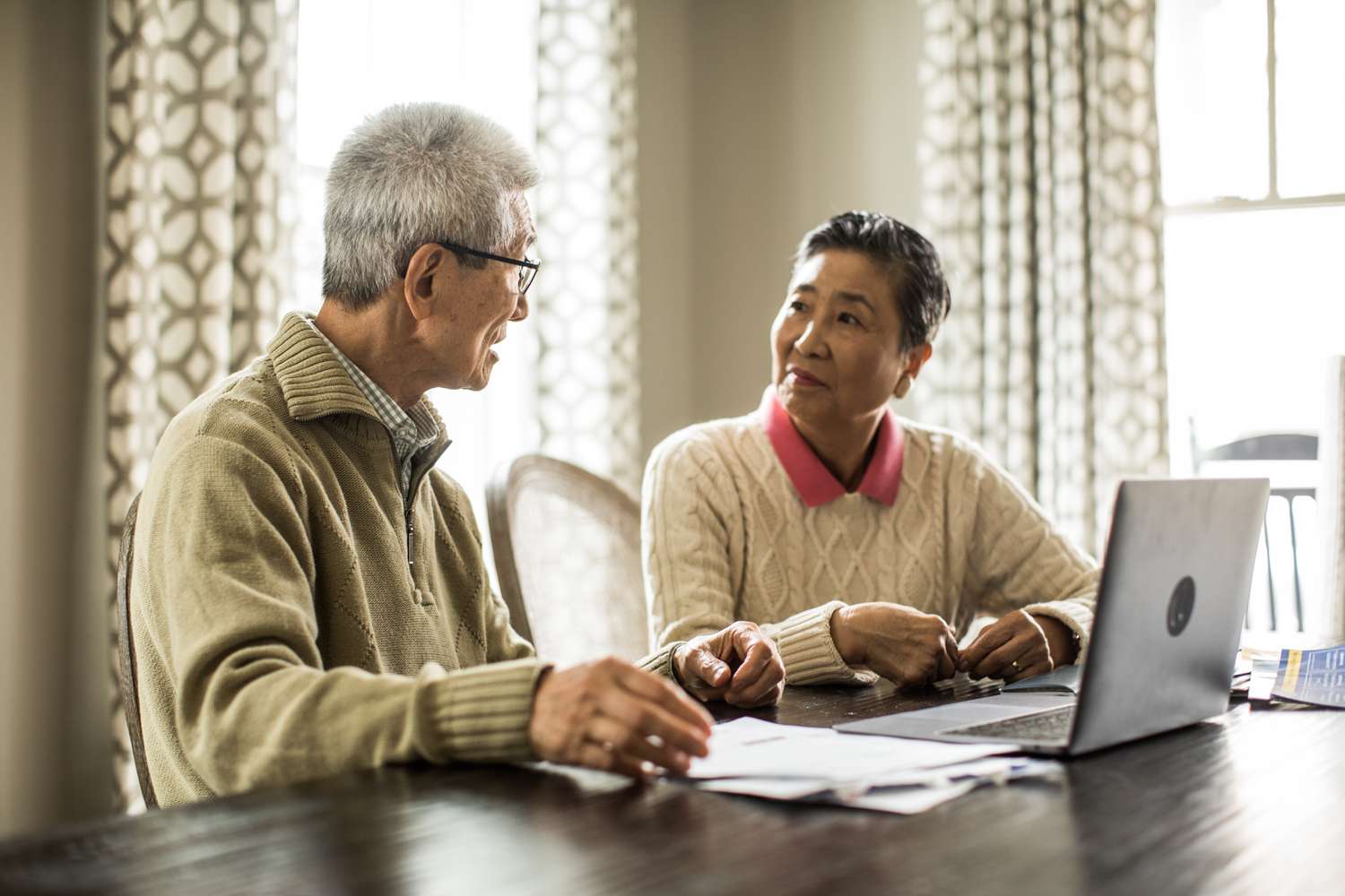 Couple discussing whether defaulting on their student loans will reduce their social security benefits