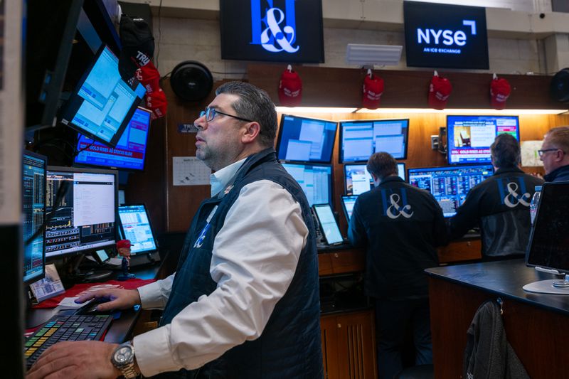 Traders work on the floor of the New York Stock Exchange