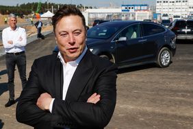 Tesla CEO Elon Musk talks to media as he arrives to visit the construction site of the future US electric car giant Tesla, on September 03, 2020 in Gruenheide near Berlin