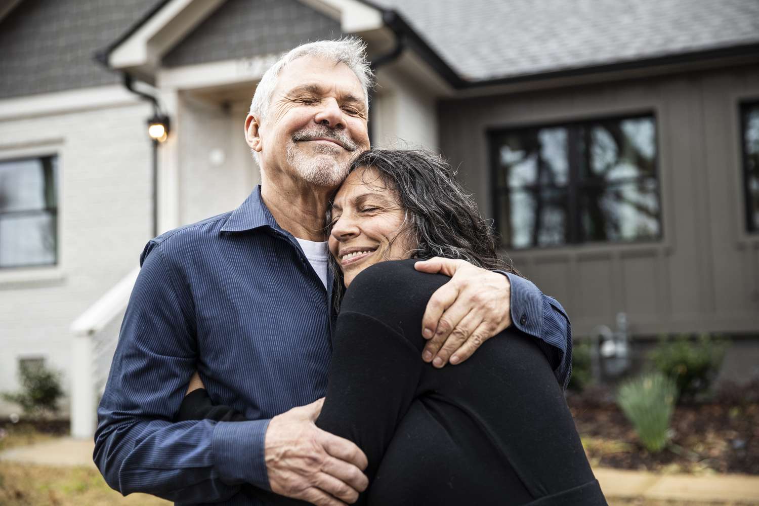 Happy senior couple after paying off mortgage