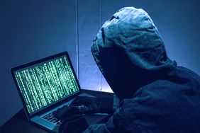 A depiction of a hacker stealing passwords.