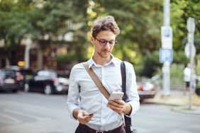 Young man looking at his mobile phone