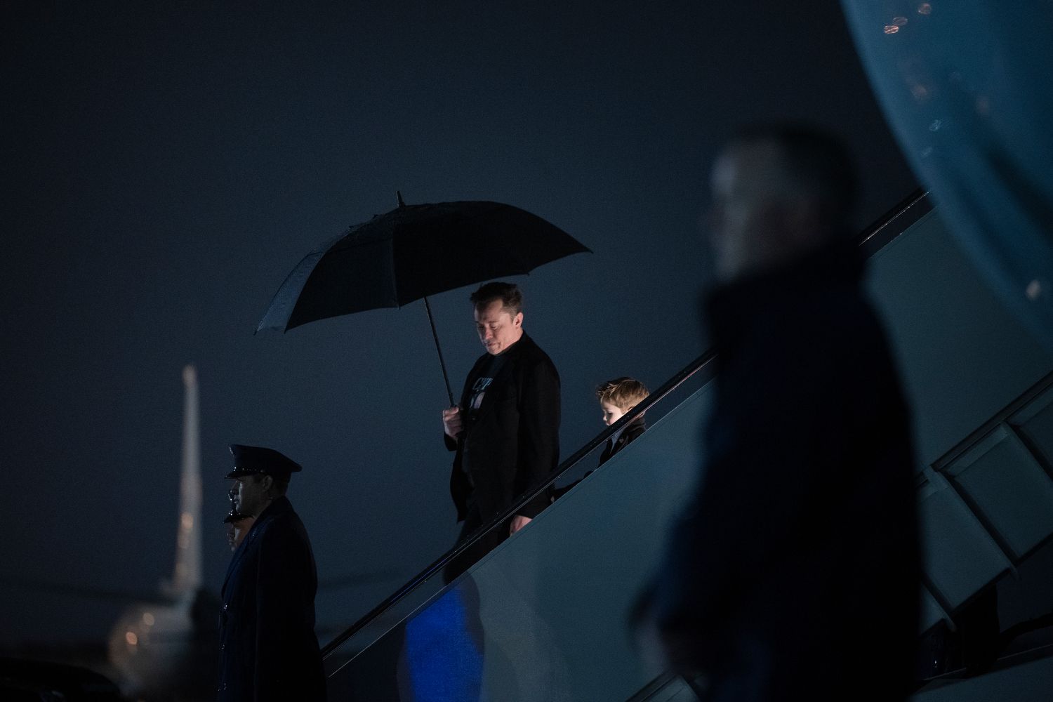 Tesla CEO Elon Musk and his son step off of Air Force One upon arrival at Joint Base Andrews in Maryland, on March 17, 2025.