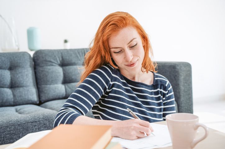 Woman works on papers