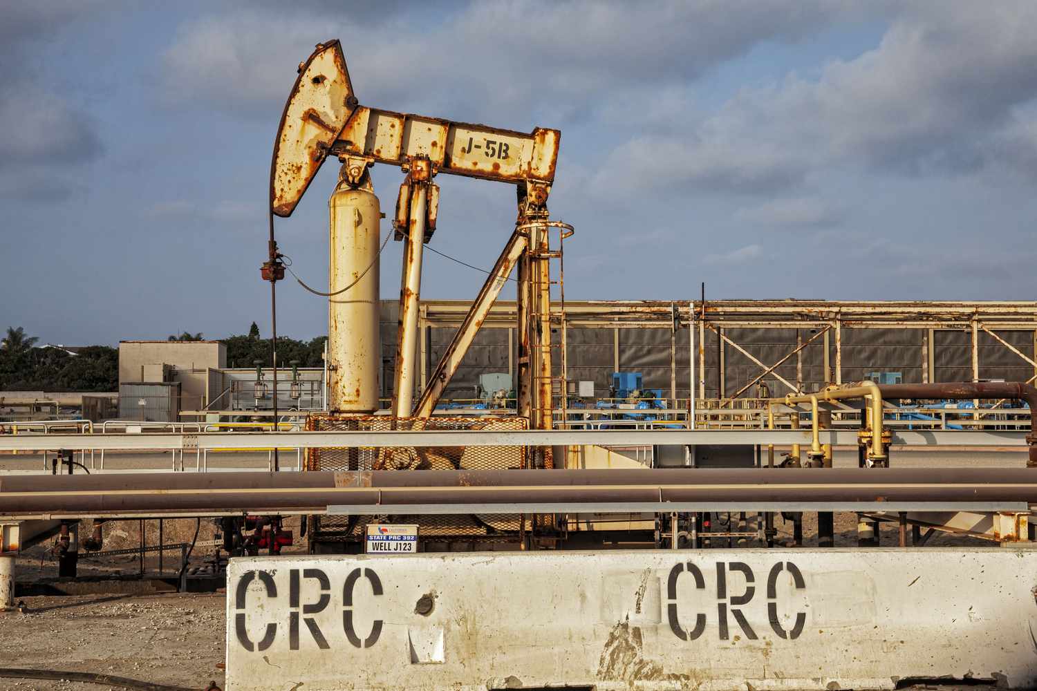 Oil pumpjack in an industrial area, labeled with CRC