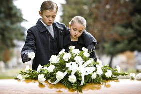 Children in front of casket