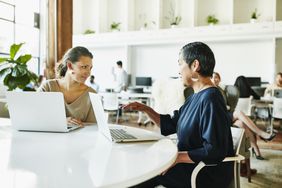 Financial advisor in meeting with client about CD rates