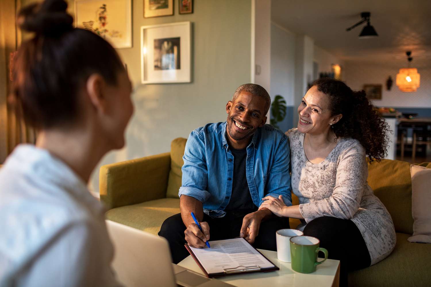 Mid adult couple talking to their financial advisor about reverse mortgage