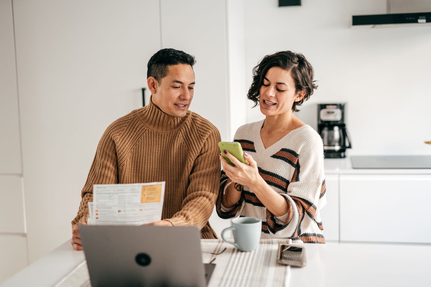 A couple contacting their lender to exercise the float down option in their mortgage.
