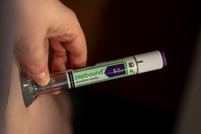 Close-up of a patient using an Eli Lilly & Co. Zepbound injection pen.