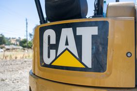 Close-up of CAT (Caterpillar Inc) logo on construction equipment