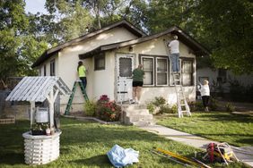People painting a house