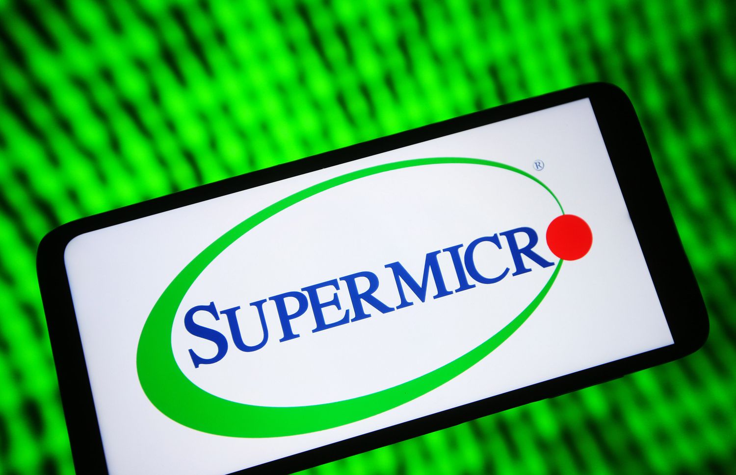 Supermicro (Super Micro Computer Inc.) logo is seen on a smartphone screen