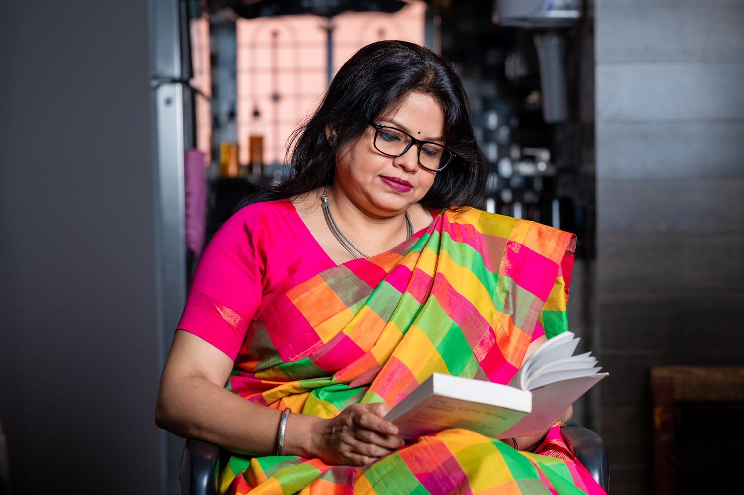 Woman reading book at home