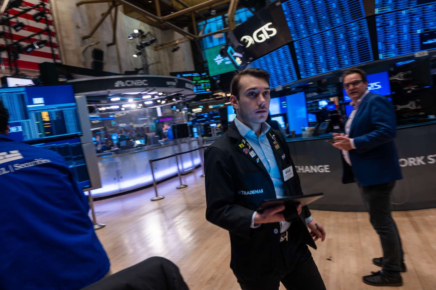 Traders work on the floor at the New York Stock Exchange.