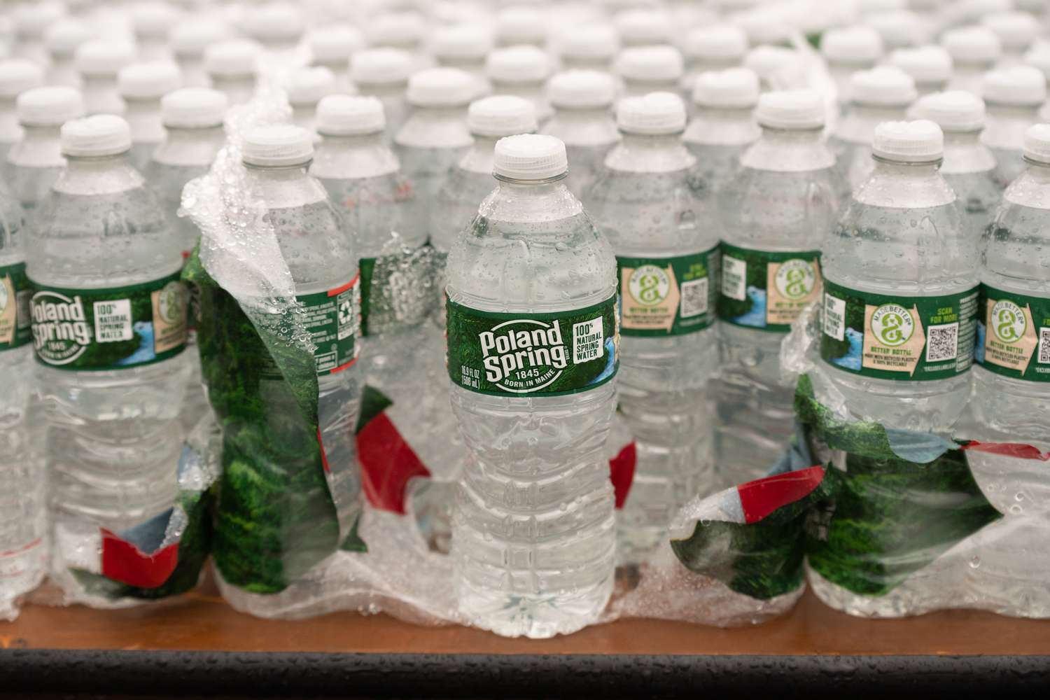 Raindrops collect on Poland Spring water bottles on a table in the finish line area of the B.A.A. Half Marathon on November 13, 2022, at Franklin Park in Boston, MA. 