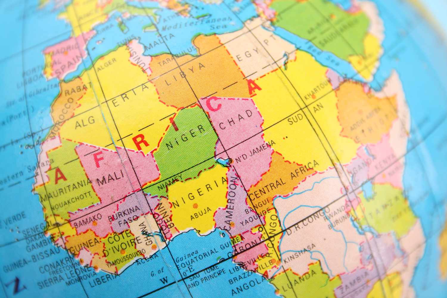 A close-up of a colorful globe, showing a map of the continent of Africa.