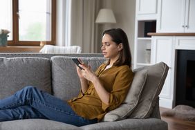 Woman searching for the best real estate apps 
