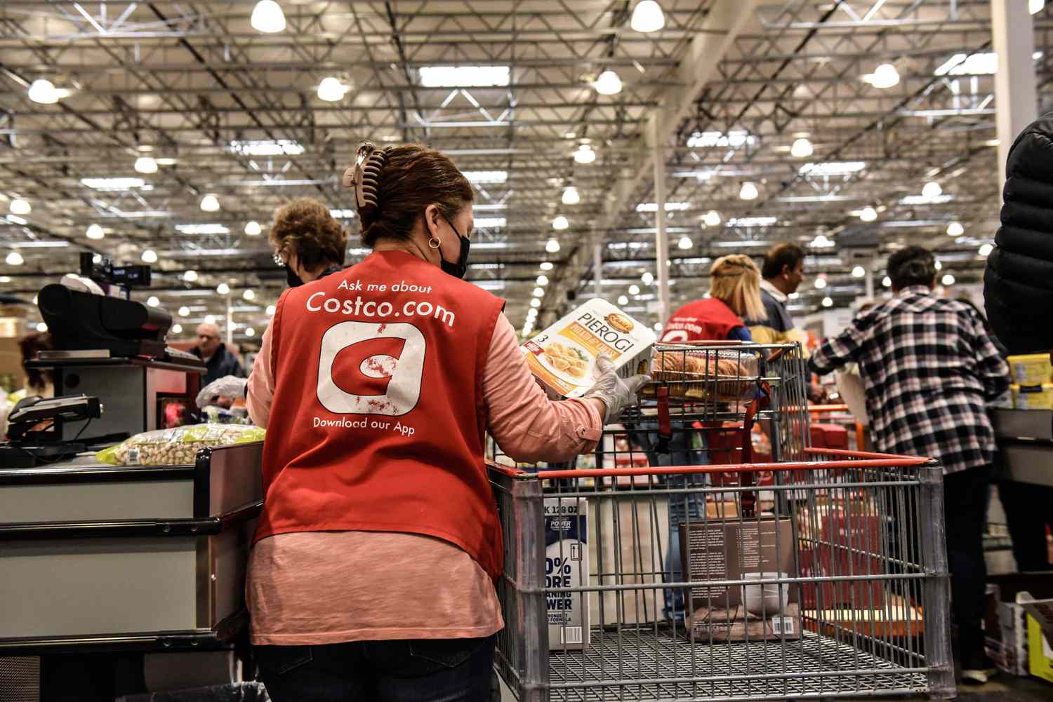 A worker in the check-out line at a Costco store in Teterboro, New Jersey