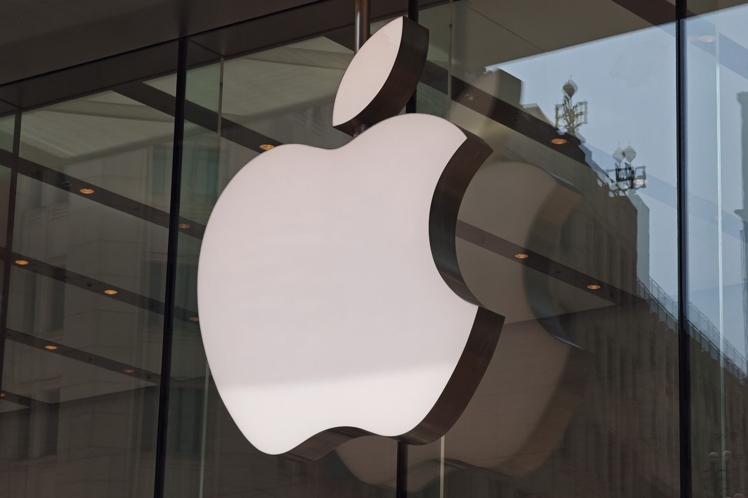 The Apple logo is displayed on the facade of the Apple flagship store in Shanghai, China.