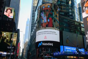 An Airbnb ad glows in Times Square in New York City. 