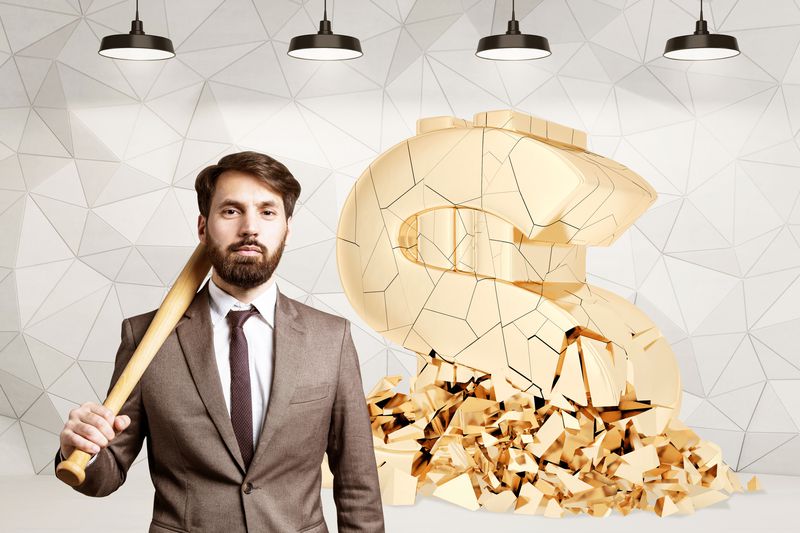 A man with a wood bat by a broken dollar