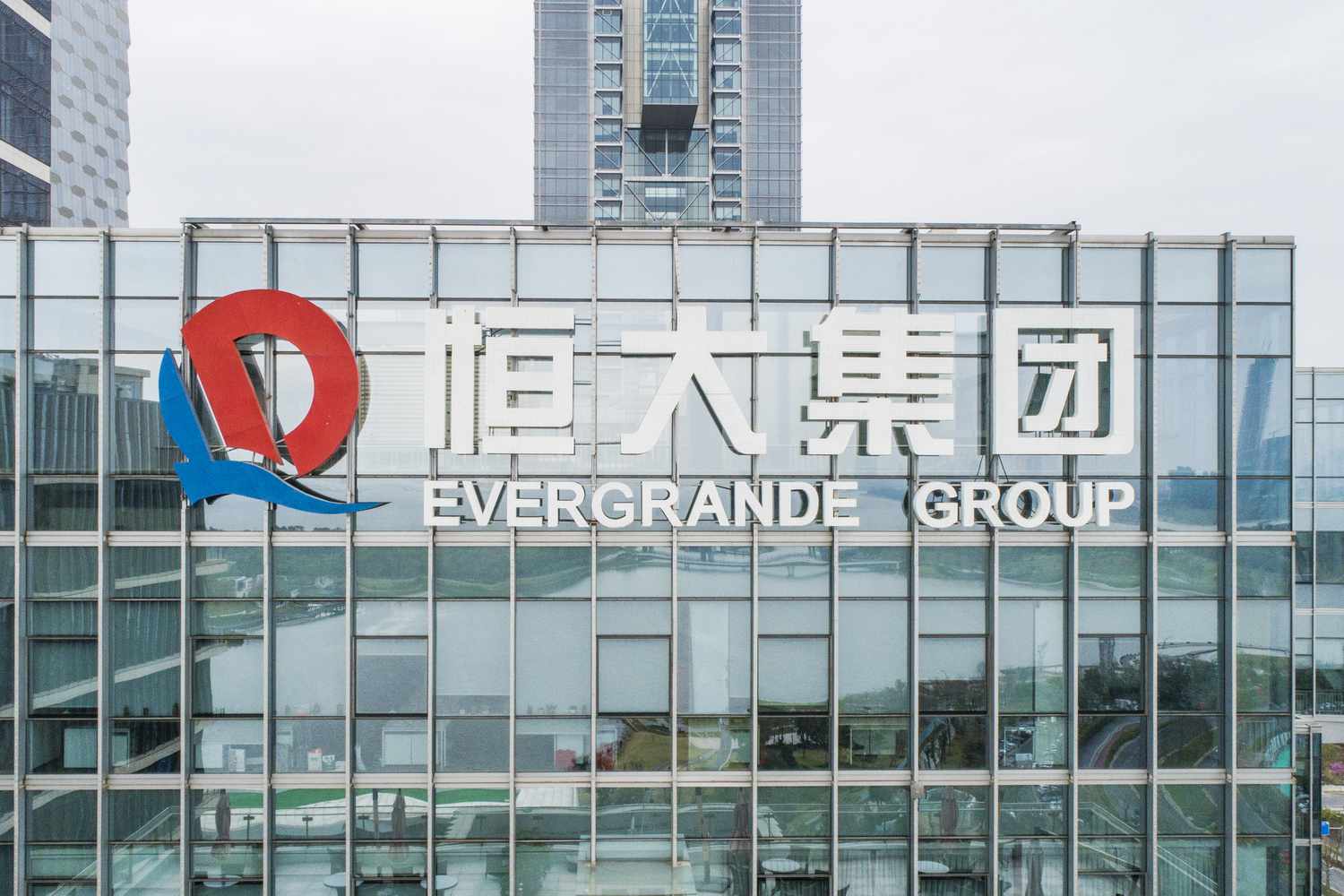 Evergrande Group logo on company headquarters building in Shenzhen, China. 