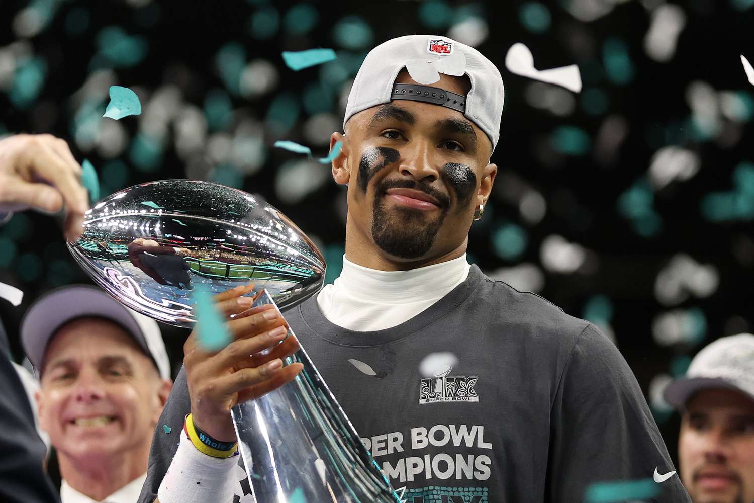 Philadelphia Eagles' quarterback Jalen Hurts holding the Vince Lombardi Trophy at Super Bowl LIX