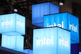Intel logos on hanging displays at an event in 2024. 