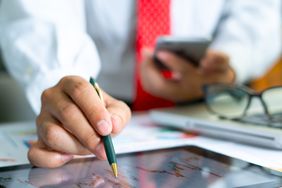 An accountant analyzing a graph stock market trading with stock chart data,.