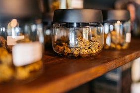 Jars of marijuana on a counter top.