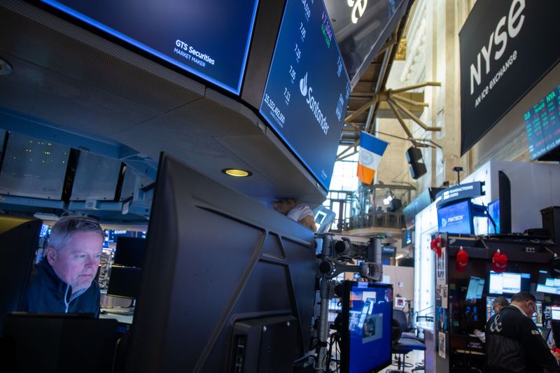 Traders work on the floor at the New York Stock Exchange