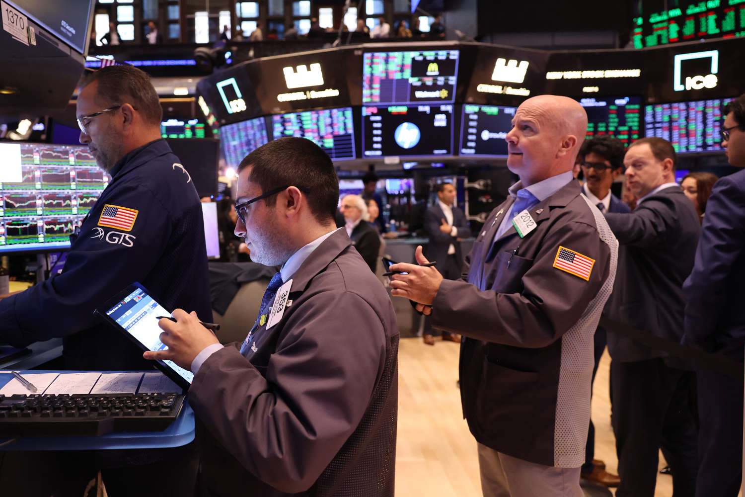 Traders work on the floor of the New York Stock Exchange