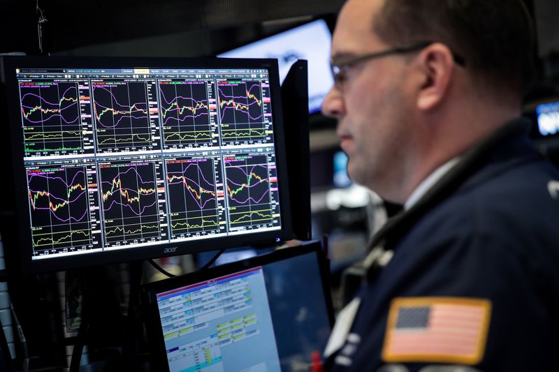 A trader's computer screen is displayed as financial professional work on the floor of the New York Stock Exchange (NYSE) ahead of the closing bell, May 15, 2017 in New York City. The Dow Jones industrial average was up 85 points at close on Monday, in addition to record setting days by the Nasdaq and S&P 500. 