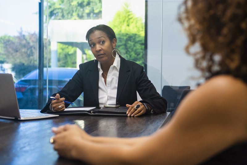 Interviewer giving interviewee questioning look.