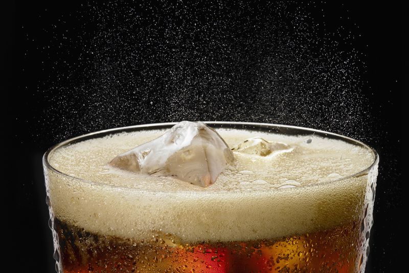 fizzy glass of cola with ice