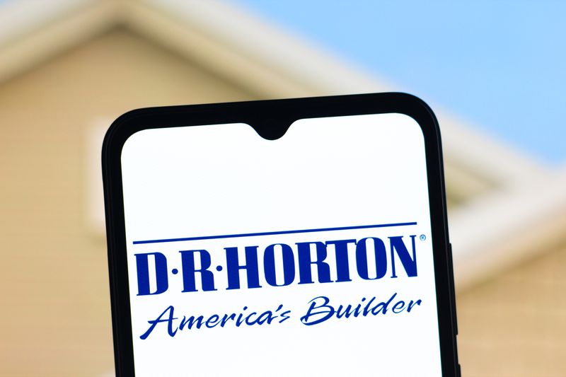The DR Horton logo is seen displayed on a smartphone screen