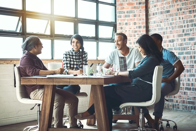 Coworkers together in startup meeting