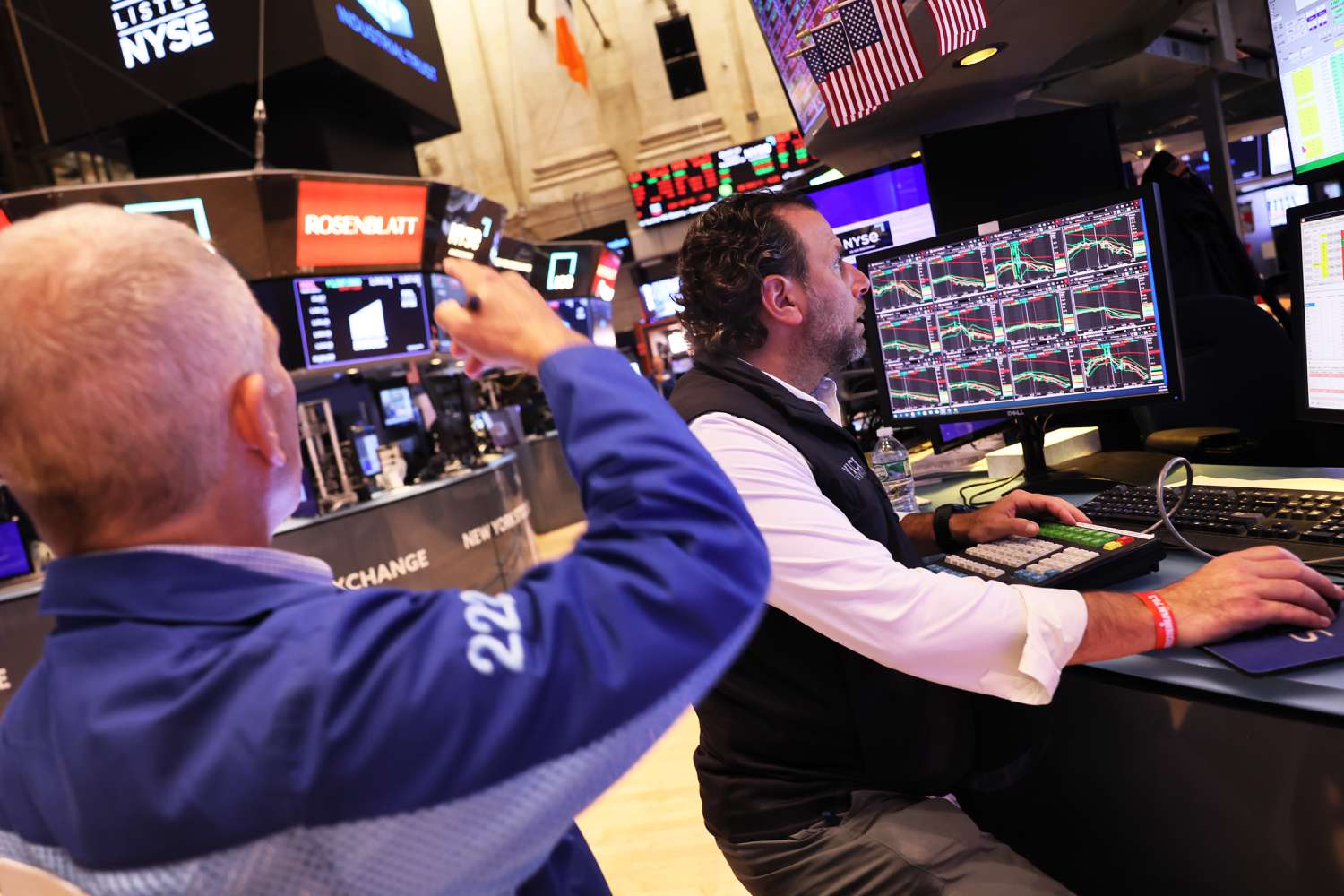 Traders work on the floor of the New York Stock Exchange