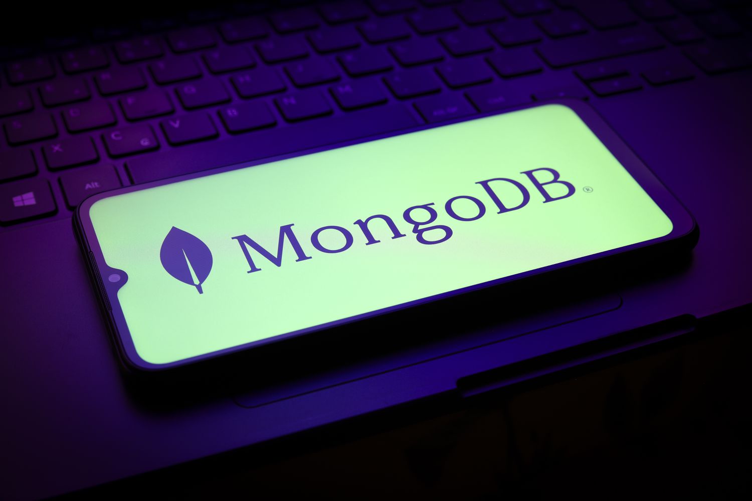 The MongoDB, Inc. logo appears on a smartphone screen