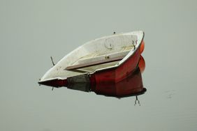 A red sunken boat. 