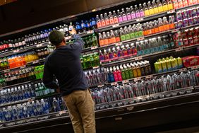 A man stocks shelves at a grocery store in Brooklyn on May 13, 2025 in New York City. 