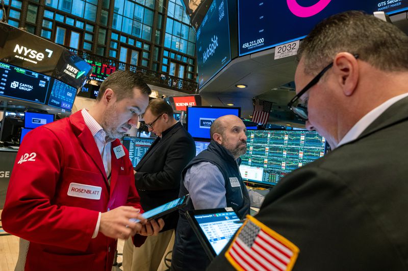 Traders work on the floor of the New York Stock Exchange 