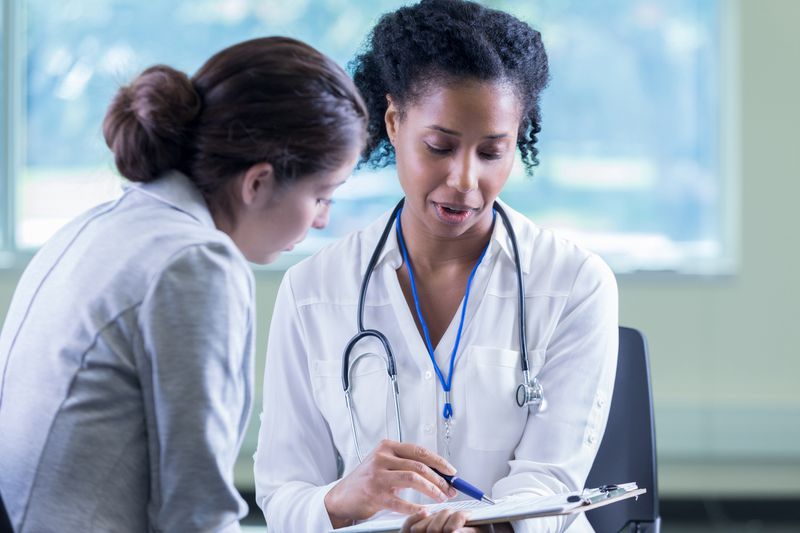 Doctor reviews a patient's medical information